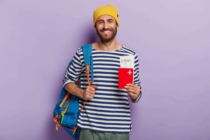 UK citizen holding his passport with his visa, ready to move to Germany