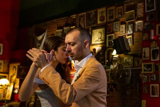Couple dancing tango in an intimate venue