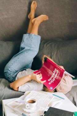 Picture of a woman reading about Spanish grammar