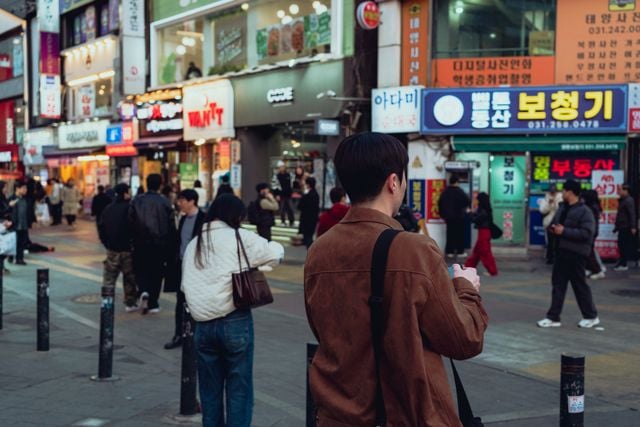 Captivating view of a vibrant street in Suwon, South Korea, showcasing everyday life and Korean culture.
