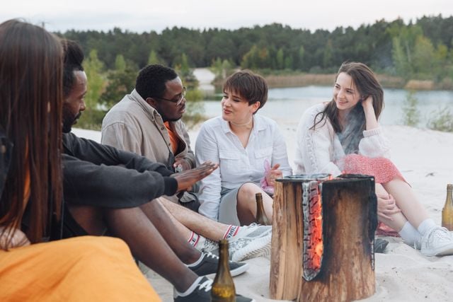 A group of friends sharing stories around a fire