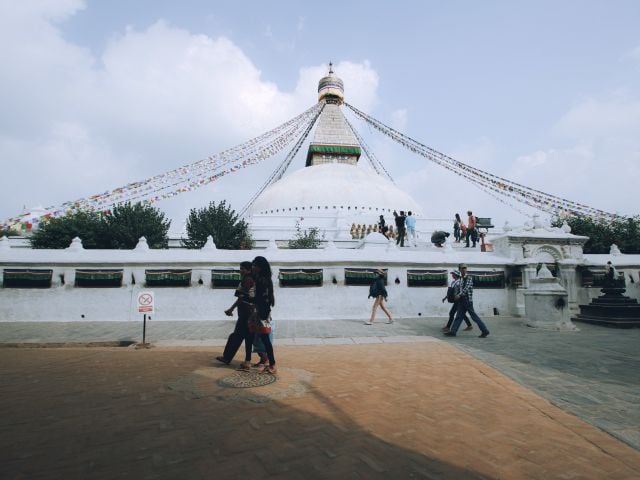 Boudhanath Stupa in Kathmandu, a popular landmark where tourists can practise useful Nepali phrases.