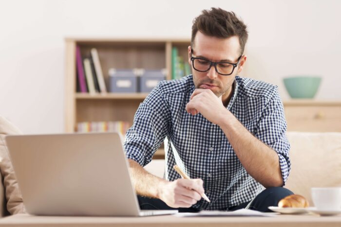 Man completing a sample test of the English language test for citizenship in the UK.